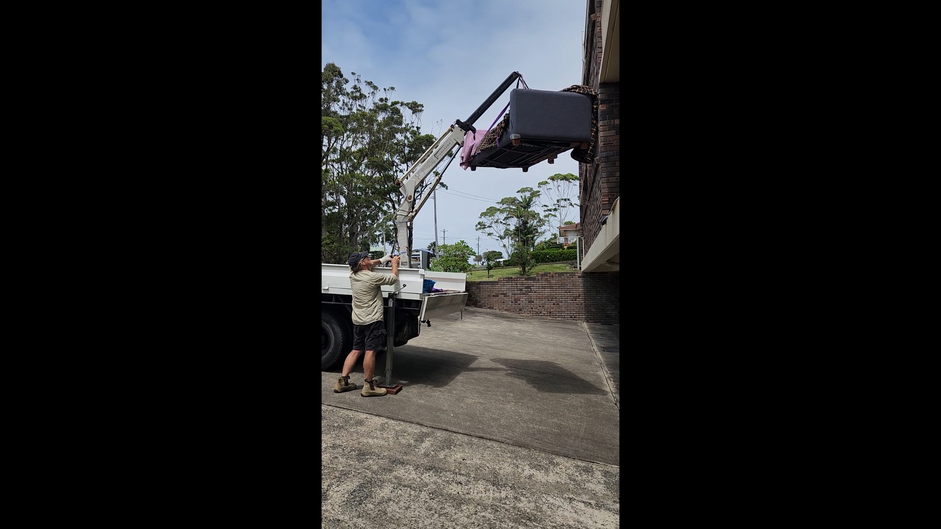 Sofa lift from second storey, high angle shot